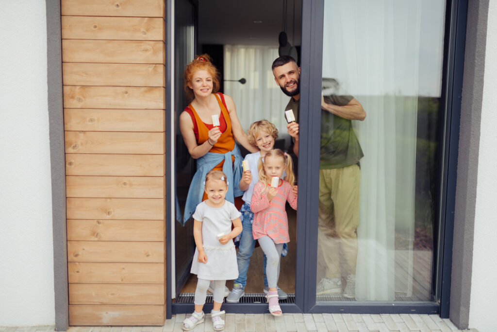 cheerful nice family holding ice cream in their hands